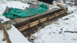 В Усинском районе продолжаются работы по капитальному ремонту моста через р. Турунъель