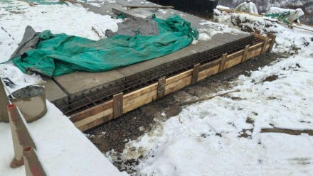 В Усинском районе продолжаются работы по капитальному ремонту моста через р. Турунъель